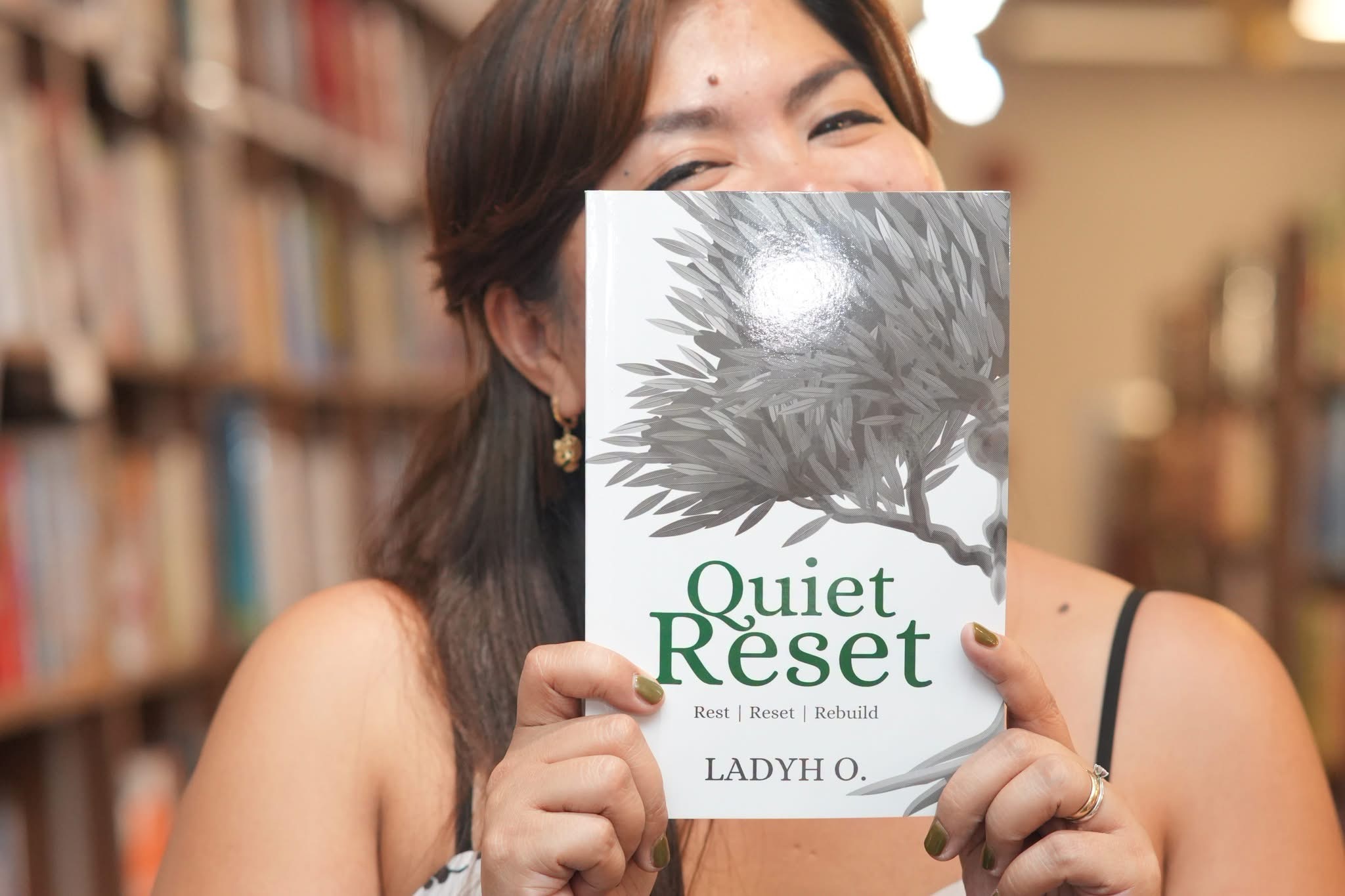 Ladyh Joy O. holding Quiet Reset